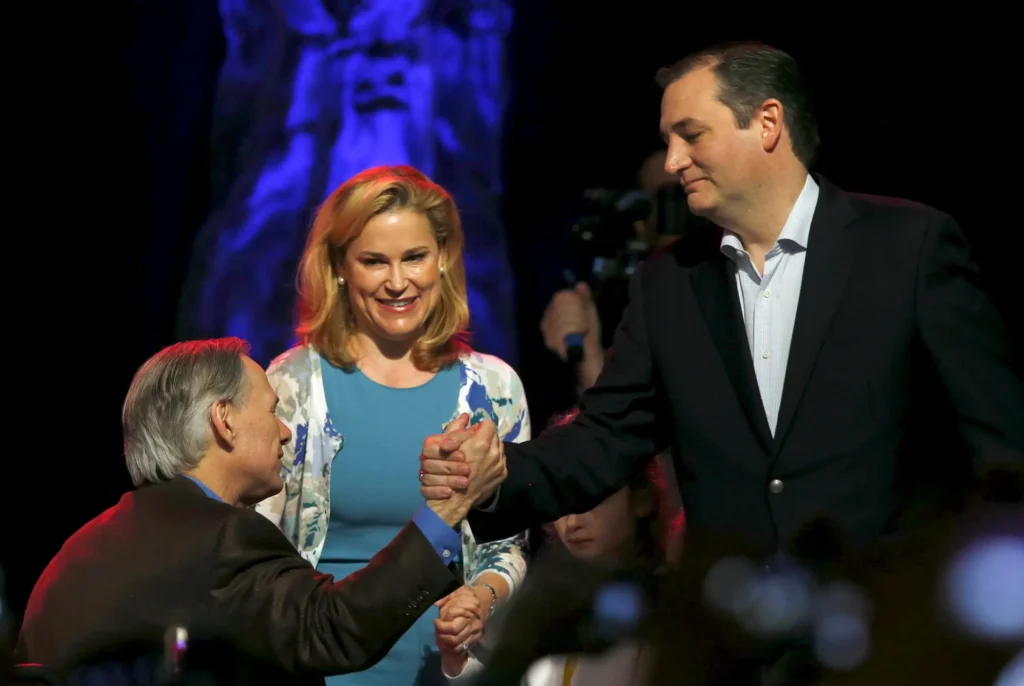 Two men shaking hands, smiling woman nearby