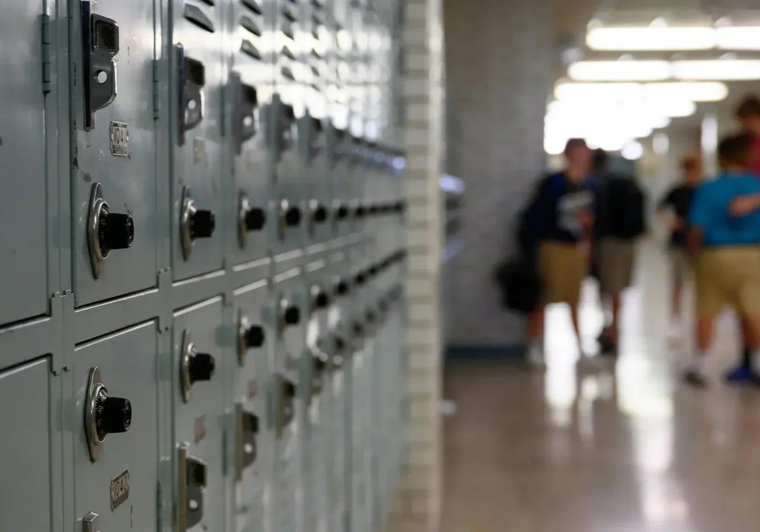 School lockers lining hallway with students
