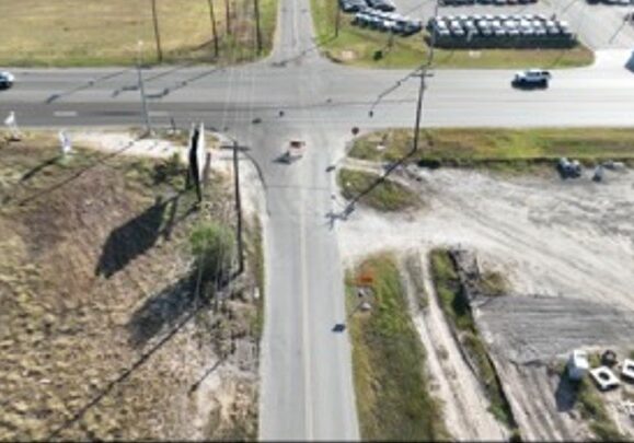 Aerial view of rural four-way road intersection