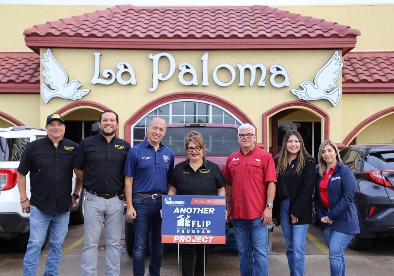 People standing outside La Paloma restaurant