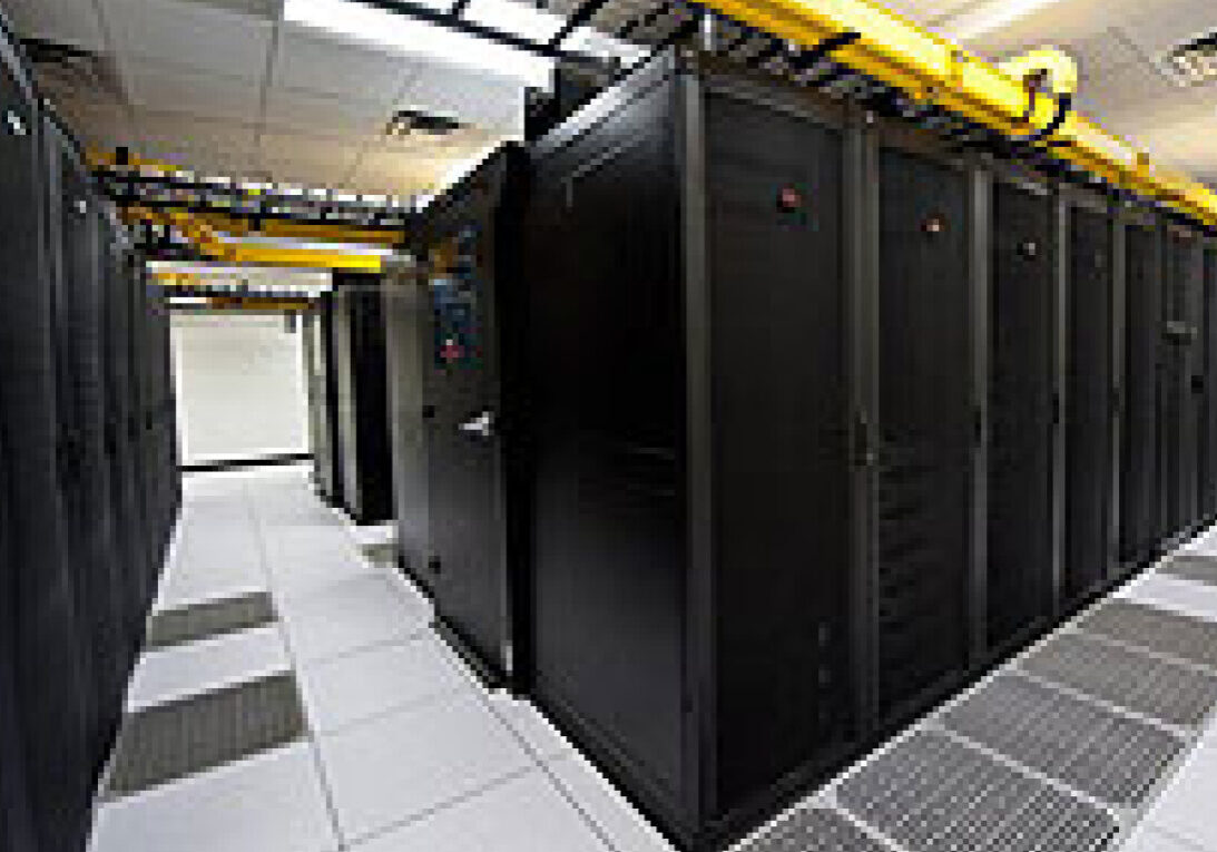 Row of black server racks in data center