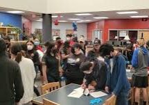 High school students gathering in school library