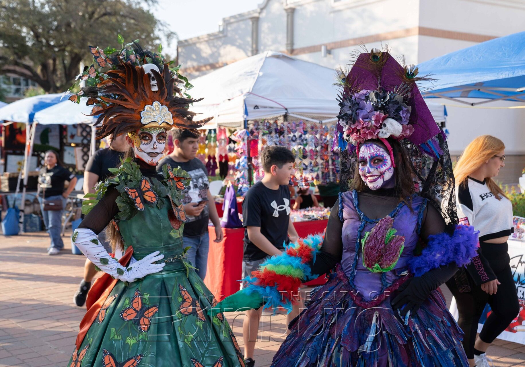 Colorful Day of the Dead costumes at market