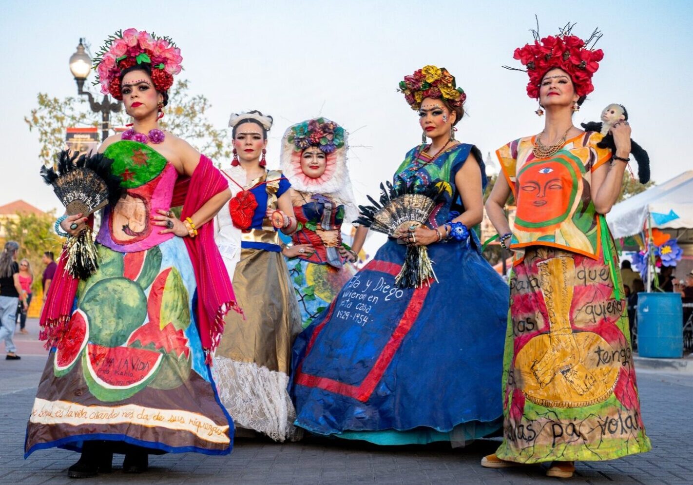 Women wearing colorful folkloric dresses and floral crowns