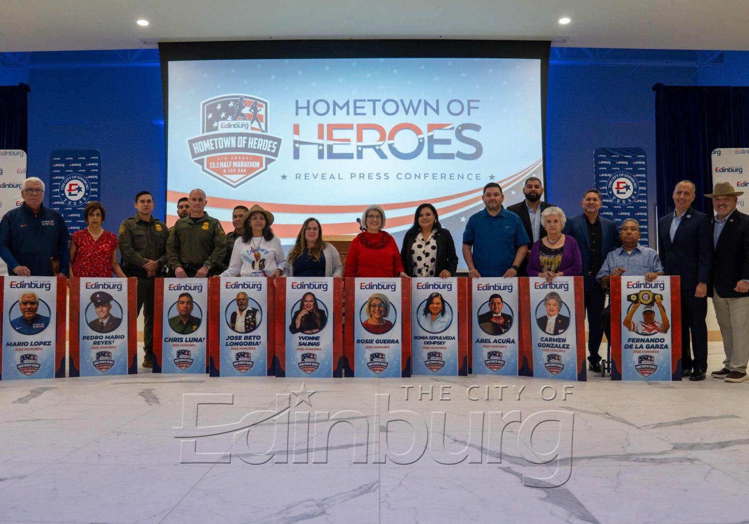 Officials presenting Hometown of Heroes banners