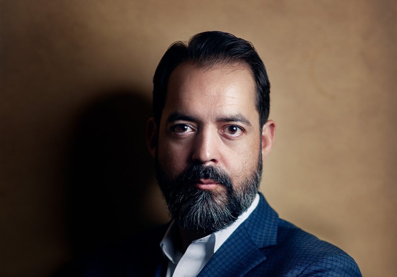 Close-up bearded man wearing navy suit