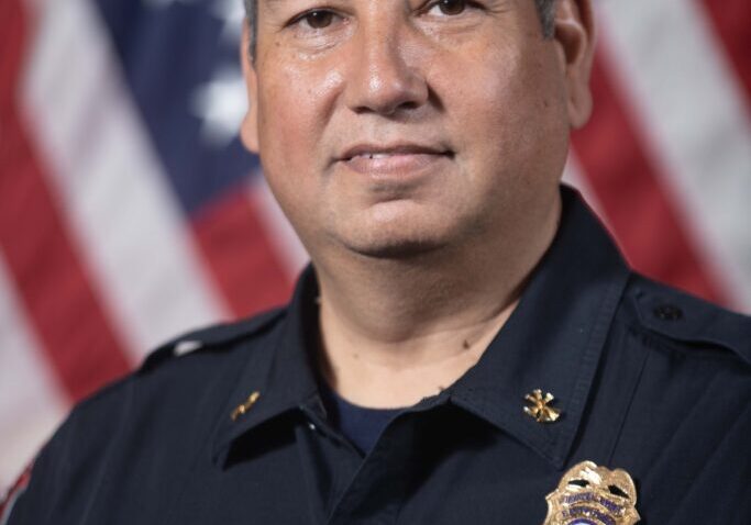 Police officer portrait with American flag