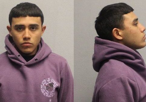 Two-view mugshot of young man in purple hoodie