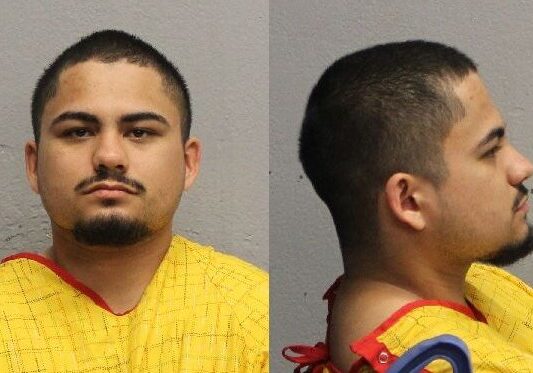 Two-view mugshot of man wearing yellow smock