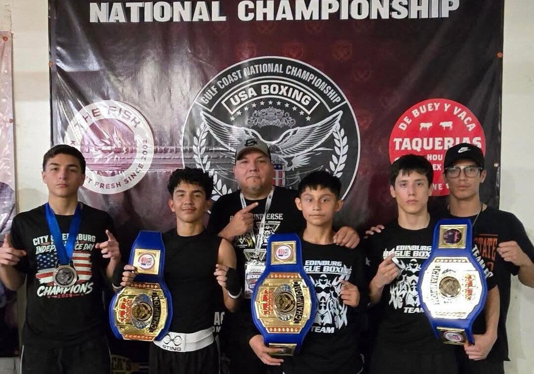 Young boxers with championship belts, Gulf Coast