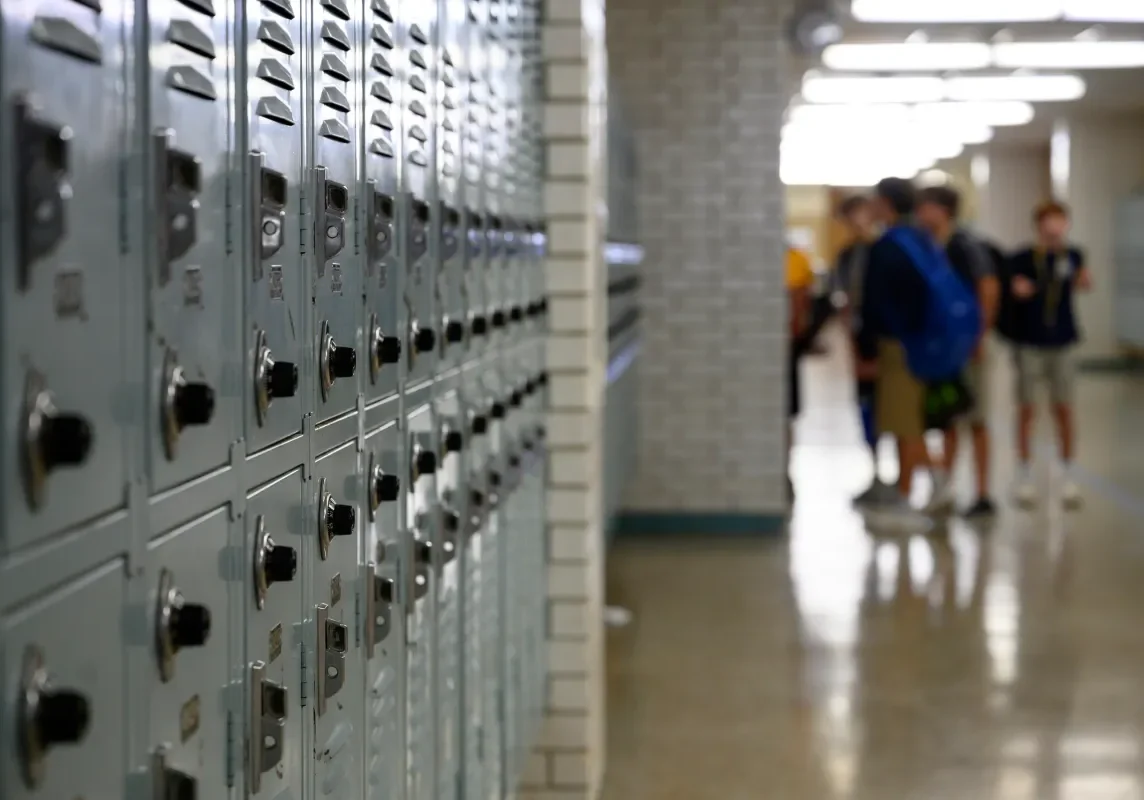 Row of metal school lockers in hallway