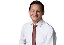 Smiling man in white shirt and red tie