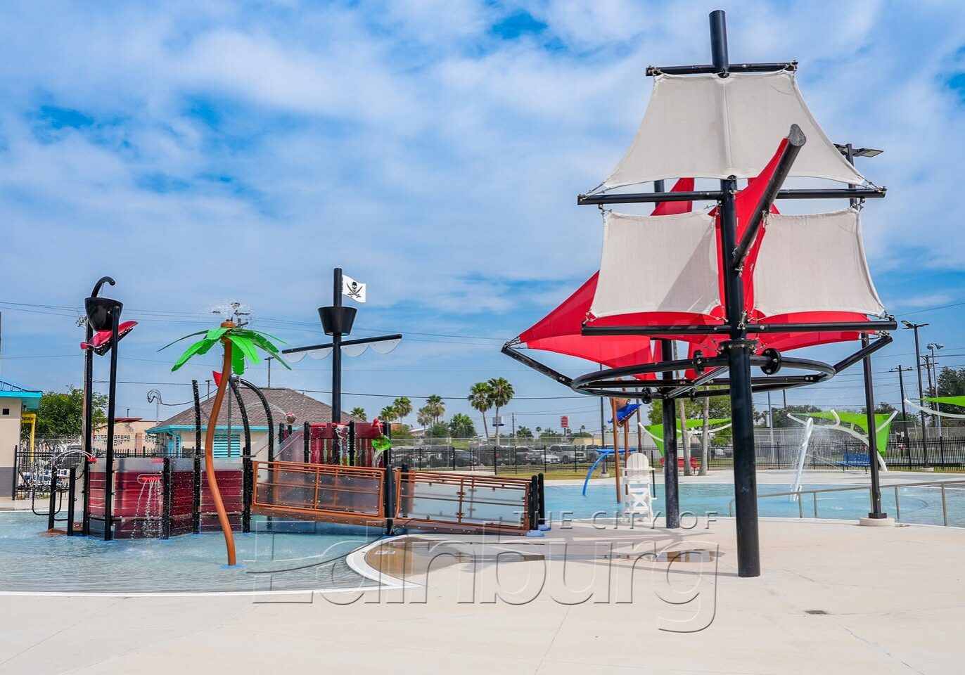 Children's pirate ship water playground with red sails