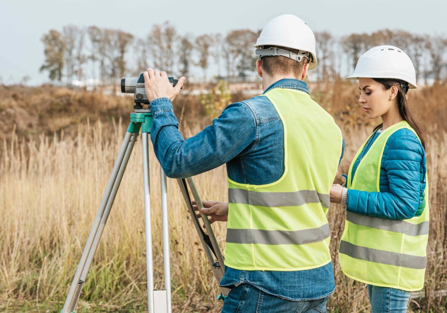 Surveyors working with digital level in field