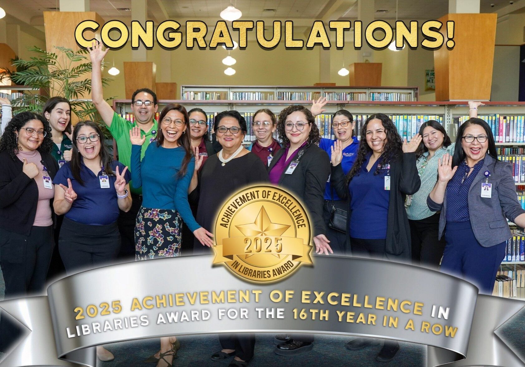 Smiling library staff celebrating 2023 excellence award