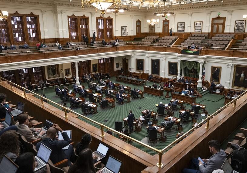 Legislative chamber session with seated lawmakers