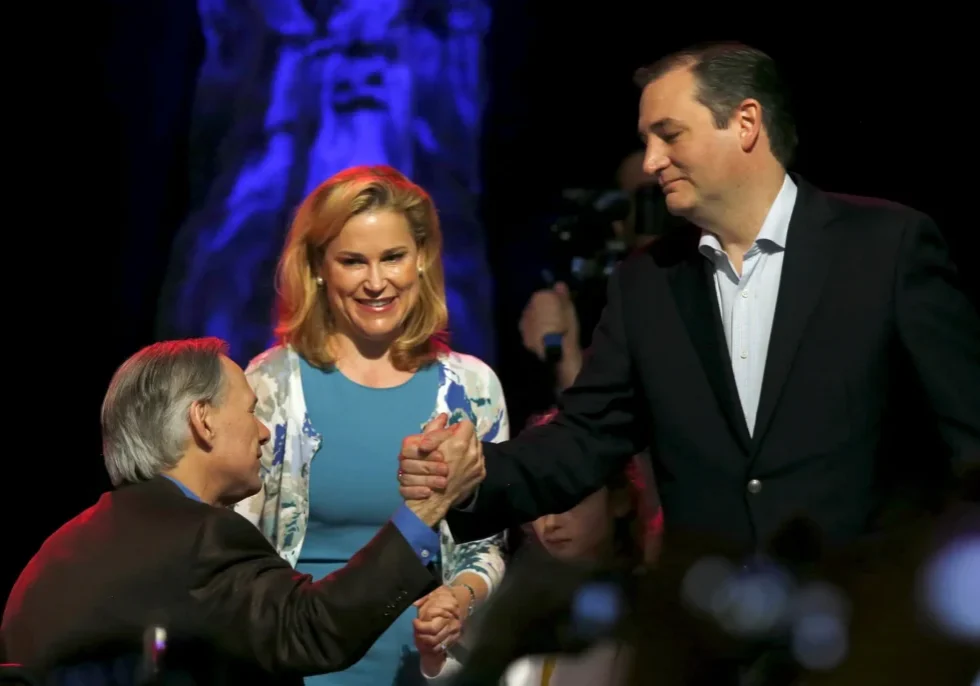 Two men shaking hands, smiling woman nearby